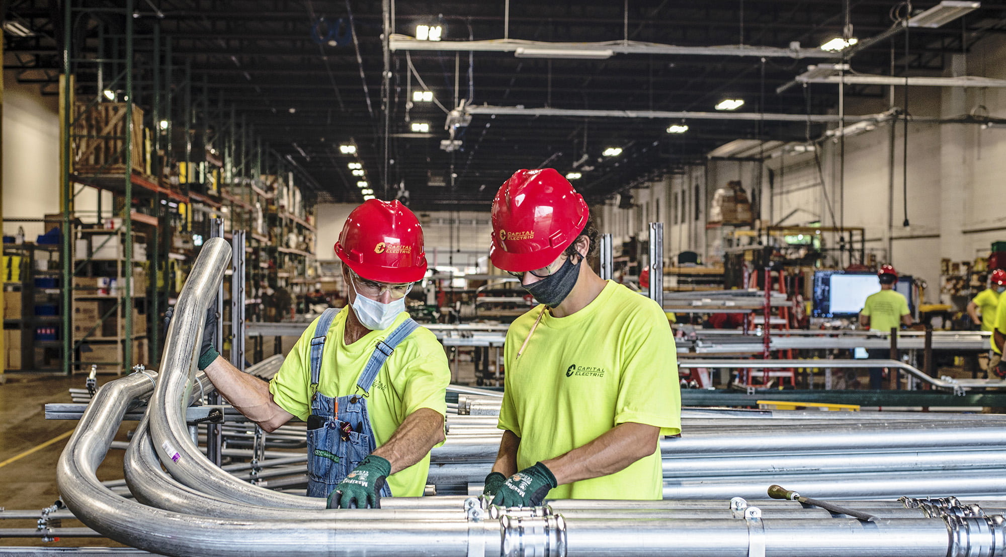 Two employees wearing masks
